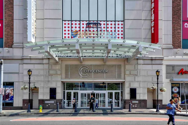 a view of a building with car parked