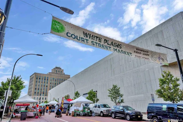 a view of building with front door and outdoor space