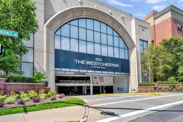 a front view of building with flowers