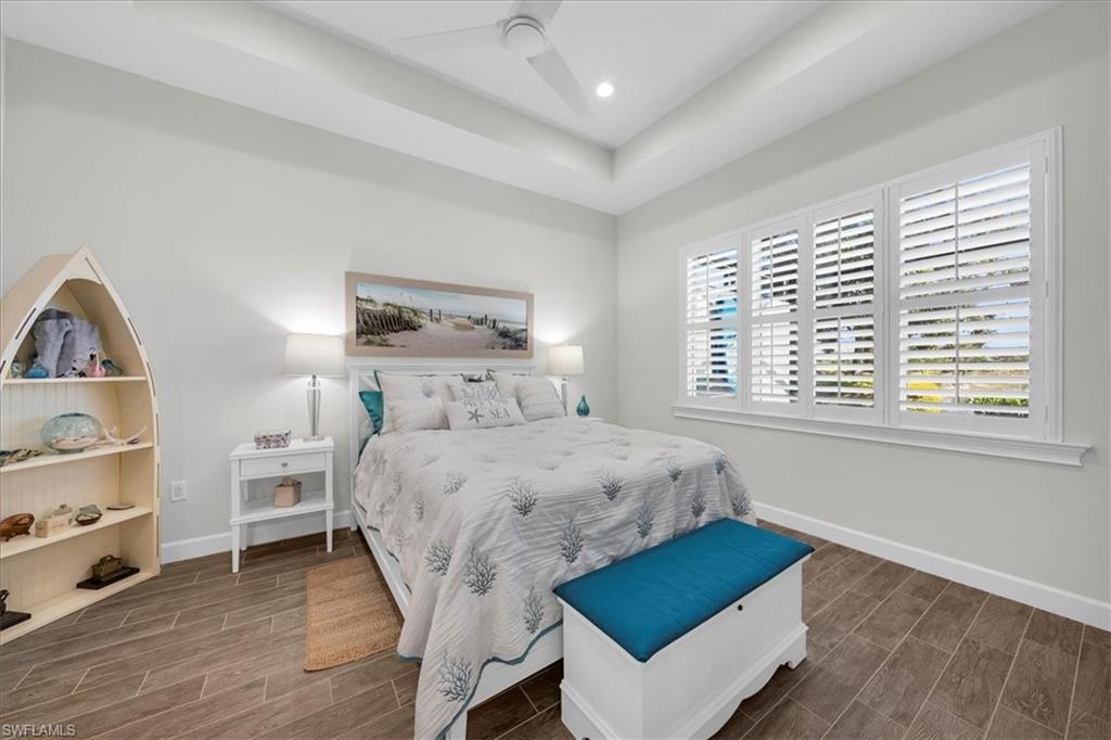 5756 Elbow Avenue Naples, FL 34113 - Photo 15 of 45 Sitting room featuring light wood-type flooring and bookshelves