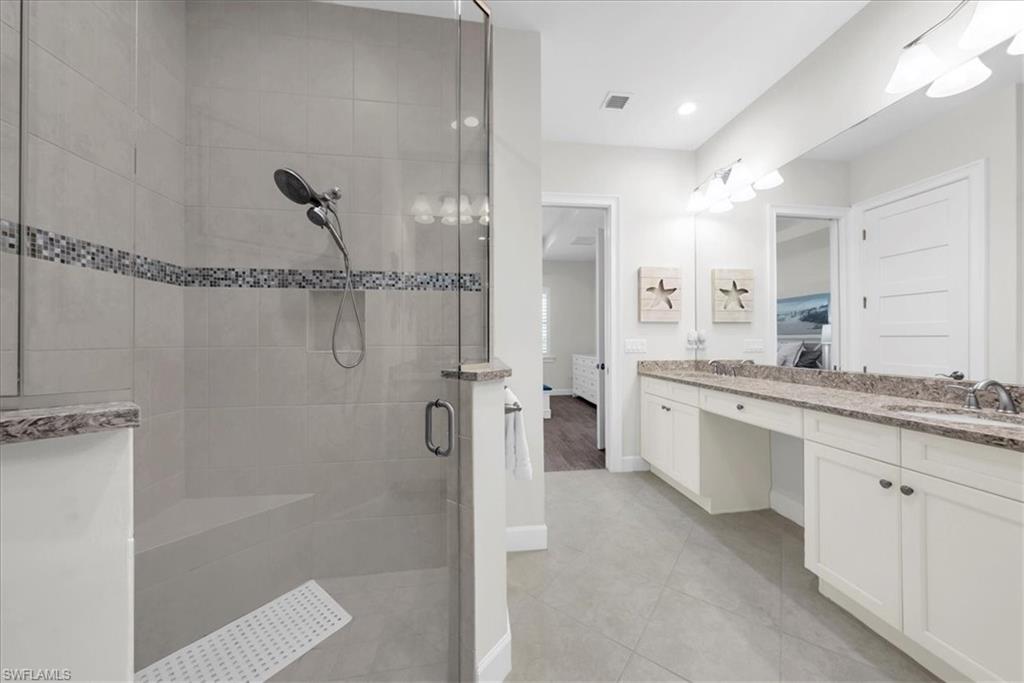 5756 Elbow Avenue Naples, FL 34113 - Photo 18 of 45 Spacious closet featuring wood tiled floors