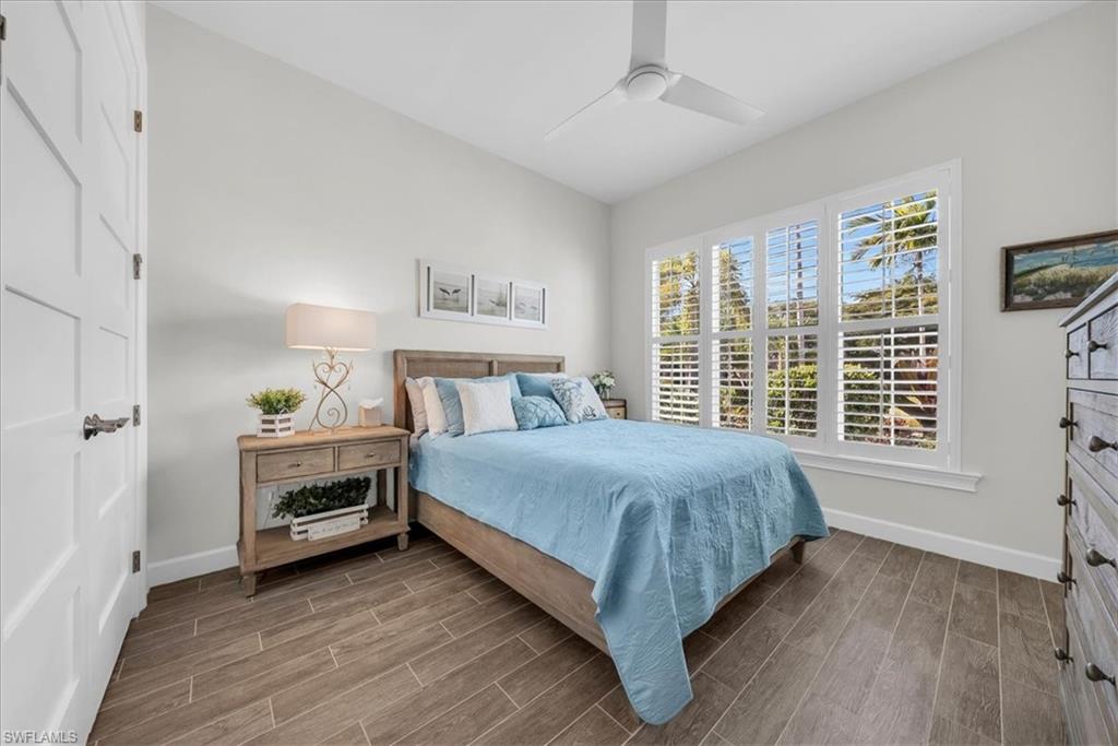5756 Elbow Avenue Naples, FL 34113 - Photo 22 of 45 Bedroom with wood tiled floors and ceiling fan