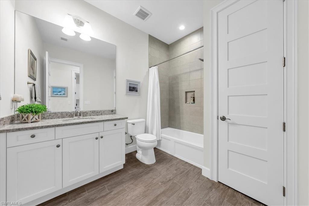5756 Elbow Avenue Naples, FL 34113 - Photo 24 of 45 Spacious closet featuring wood tiled floors