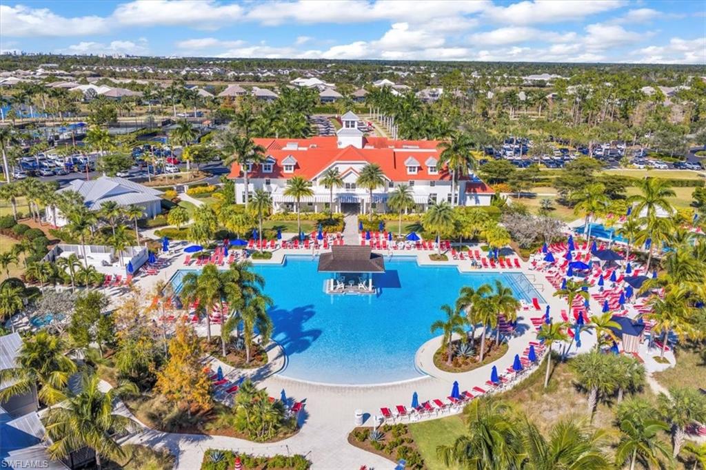 5756 Elbow Avenue Naples, FL 34113 - Photo 37 of 45 Drone / aerial view of a pool and a nearby body of water
