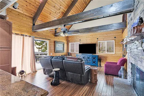 a living room with furniture a rug and a window