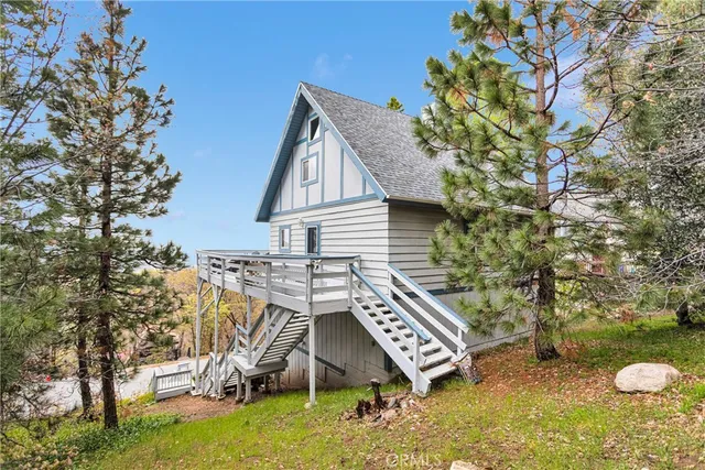 a bedroom with furniture and a wooden floor