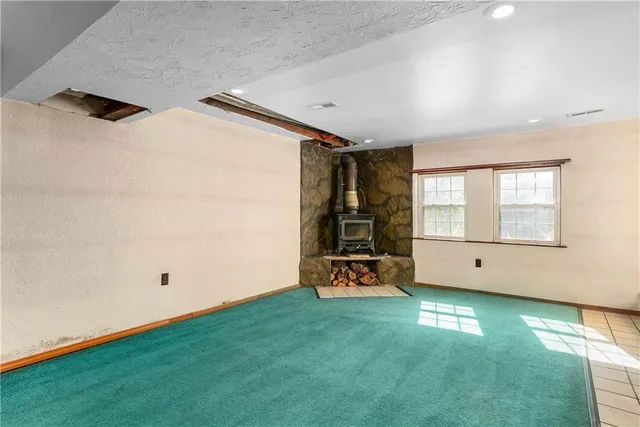 a view of a room with window and a ceiling fan