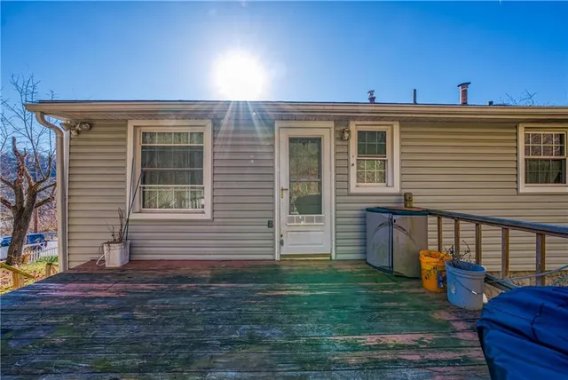 a view of a house with a backyard