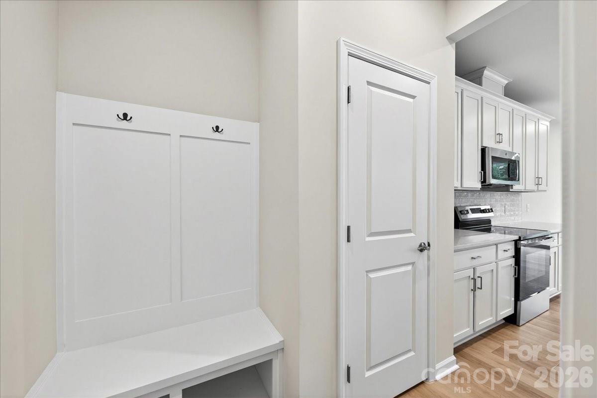 512 Webster Lane Cramerton, NC 28032 - Photo 13 of 28 a kitchen with white cabinets and white appliances