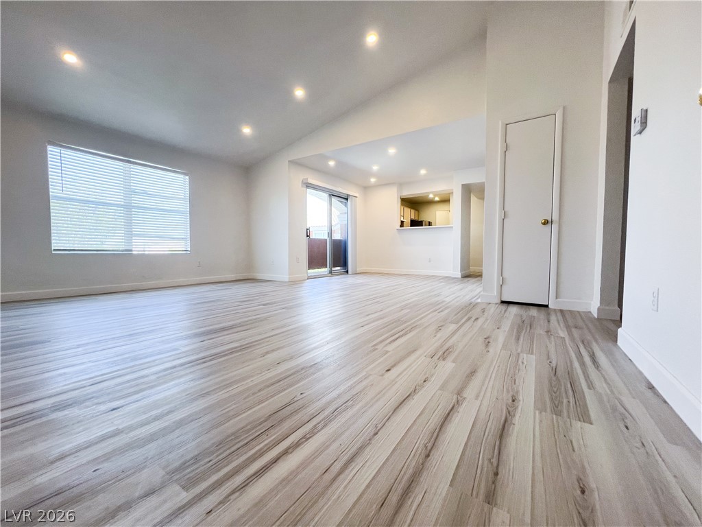 8101 West Flamingo Road, Unit 2129 Las Vegas, NV 89147 - Photo 1 of 12 Bright, open-concept living space with sleek flooring and natural illumination.
