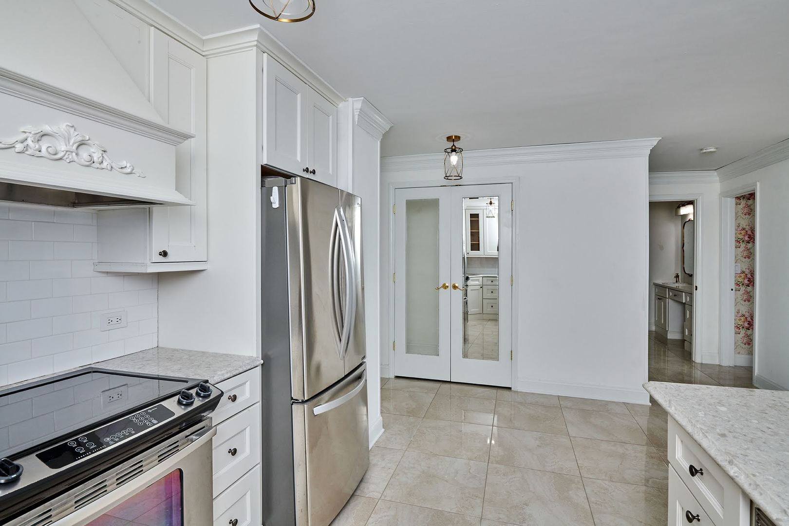 5455 North Sheridan Road, Unit 3811 Chicago, IL 60640 - Photo 19 of 35 a kitchen with stainless steel appliances granite countertop a refrigerator and a stove top oven