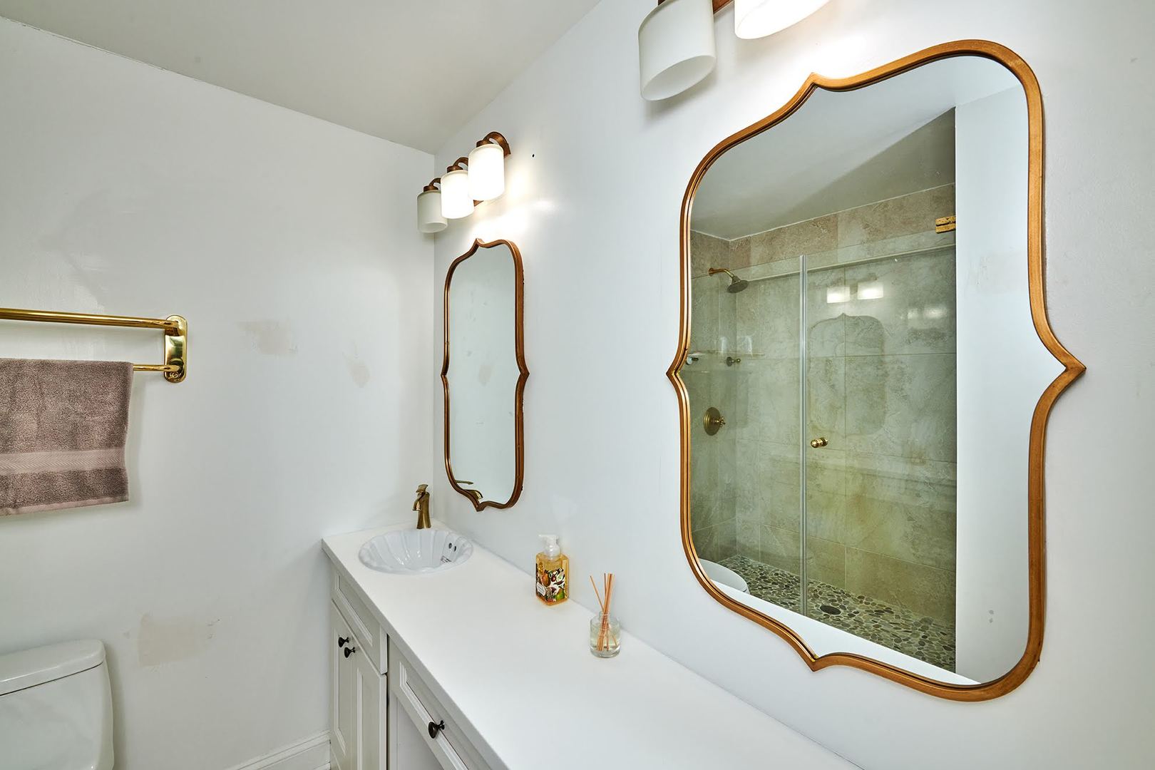 5455 North Sheridan Road, Unit 3811 Chicago, IL 60640 - Photo 23 of 35 a bathroom with a sink a mirror and a shower