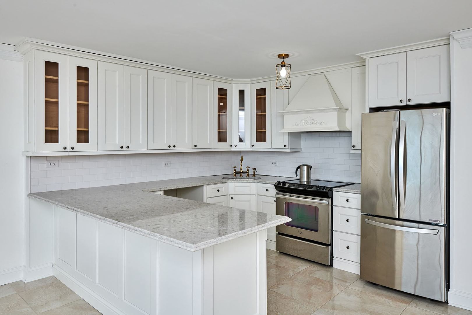 5455 North Sheridan Road, Unit 3811 Chicago, IL 60640 - Photo 9 of 35 a kitchen with stainless steel appliances granite countertop a refrigerator sink and stove