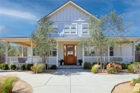 a view of a house with couches in front of house