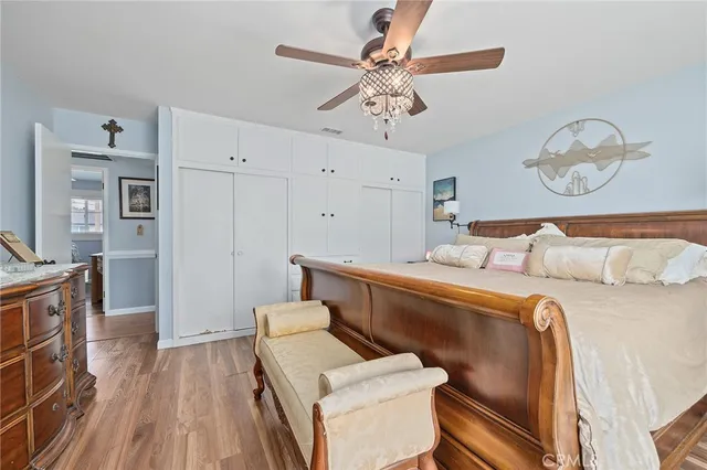 a bed room with a bed and a television