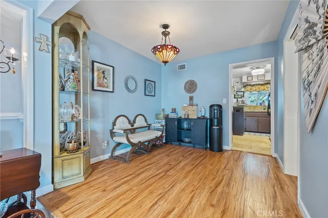 a view of a livingroom with furniture and workspace