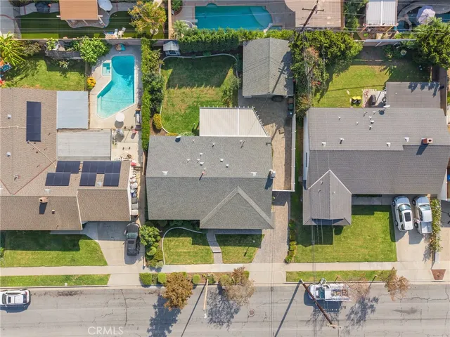 an aerial view of a house with a garden