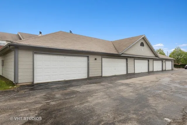 a front view of a house with a garage