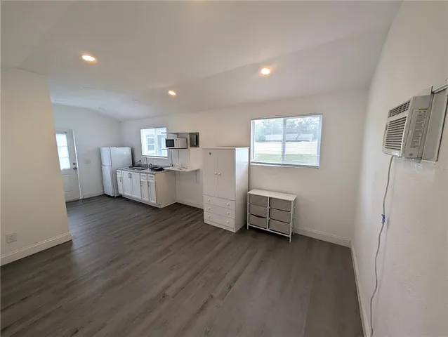 a room with furniture and wooden floor