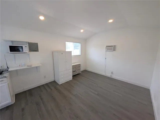 a view of a kitchen with wooden floor