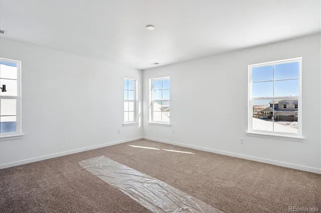 a big room with windows and closet