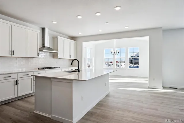 a large white kitchen with cabinets and a dishwasher