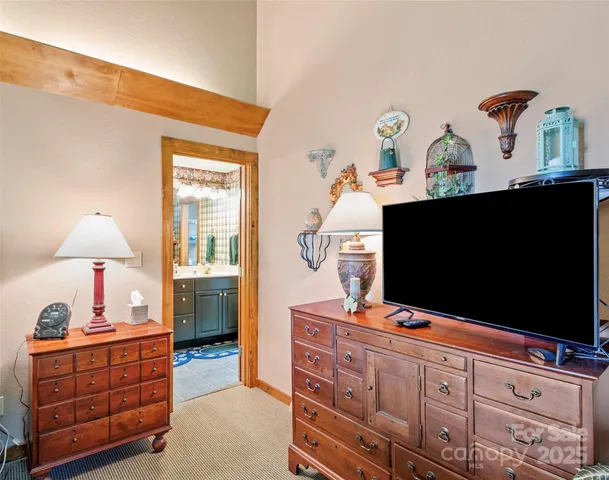 a room with furniture and flat screen tv