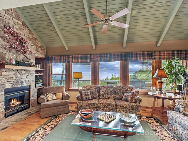 a outdoor living space with furniture and a fireplace