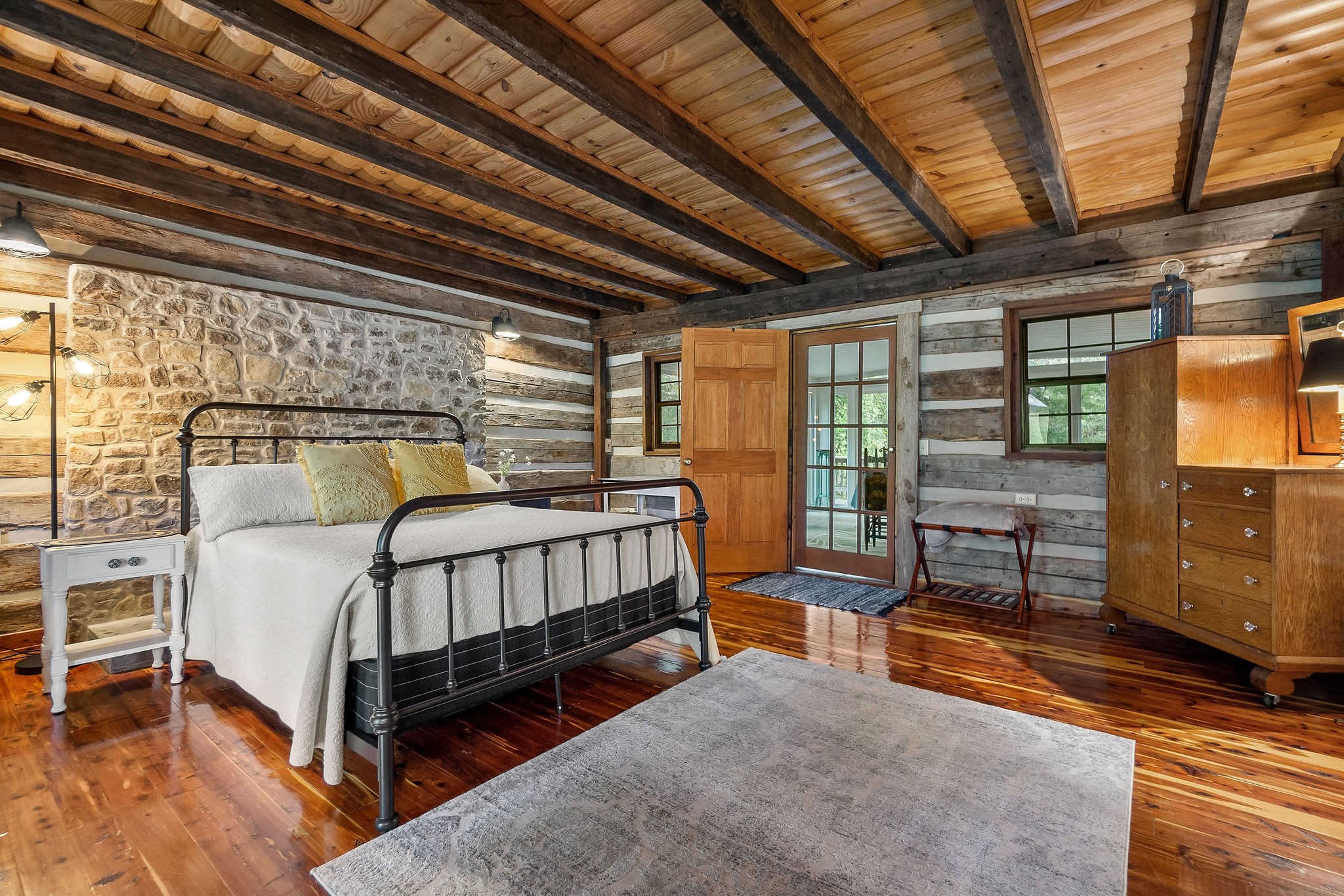 12159 Cookeville Boat Dock Road Baxter, TN 38544 - Photo 17 of 41 a bedroom with a bed and wooden floor