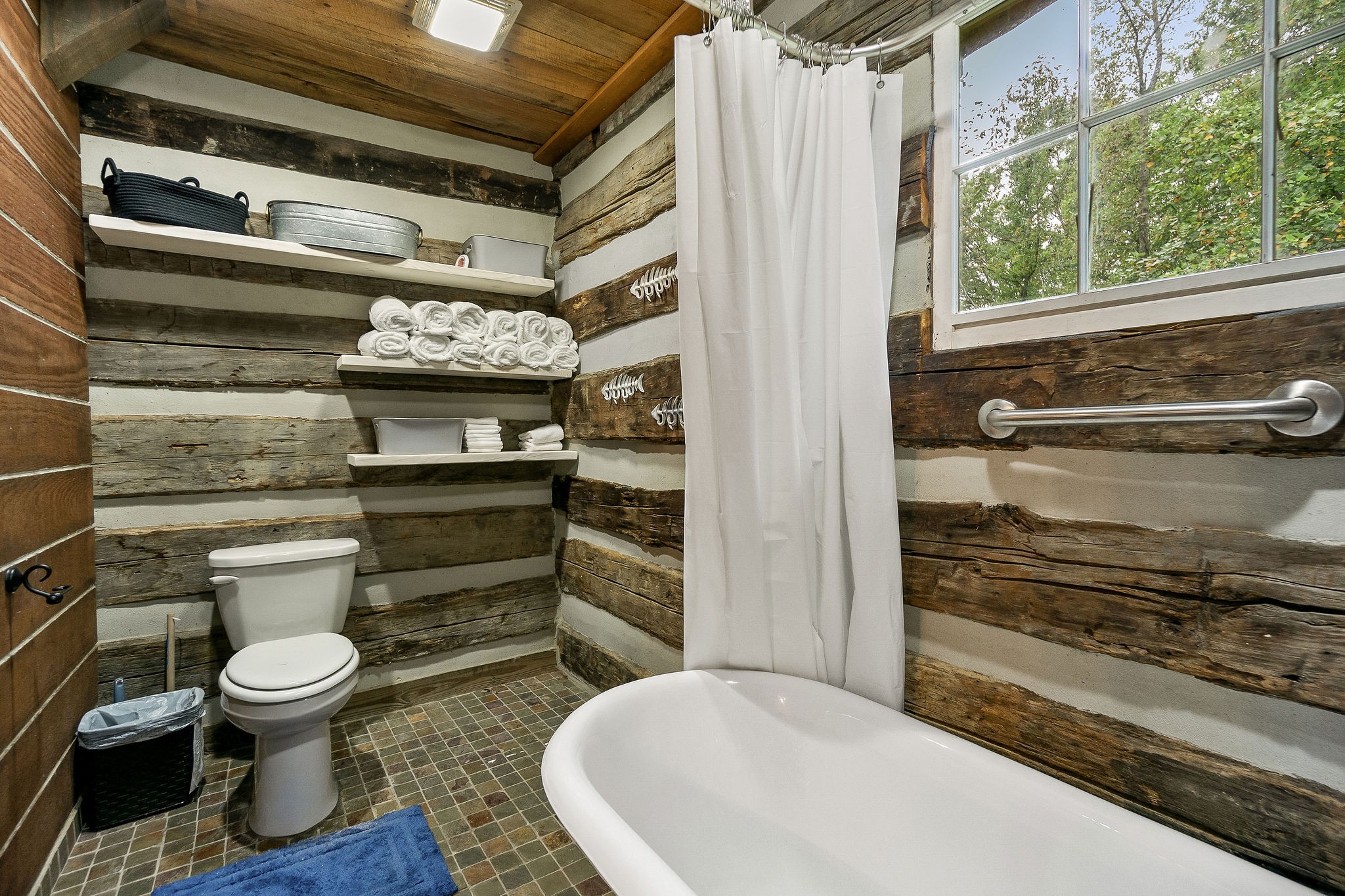 12159 Cookeville Boat Dock Road Baxter, TN 38544 - Photo 20 of 41 a bathroom with a toilet and a shower
