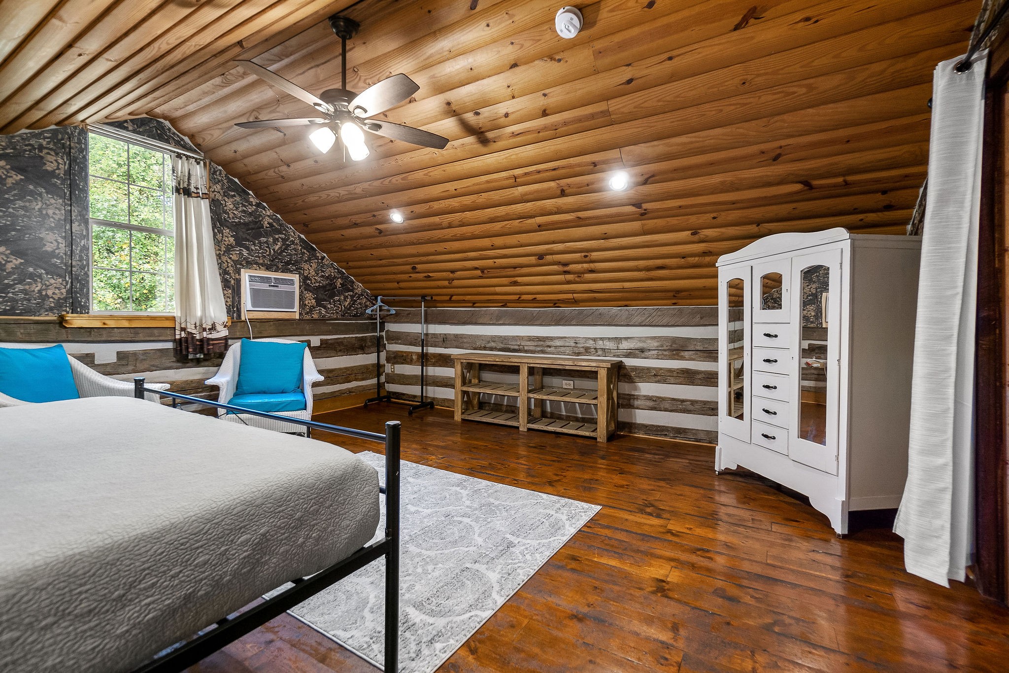 12159 Cookeville Boat Dock Road Baxter, TN 38544 - Photo 25 of 41 a bedroom with furniture and a large window