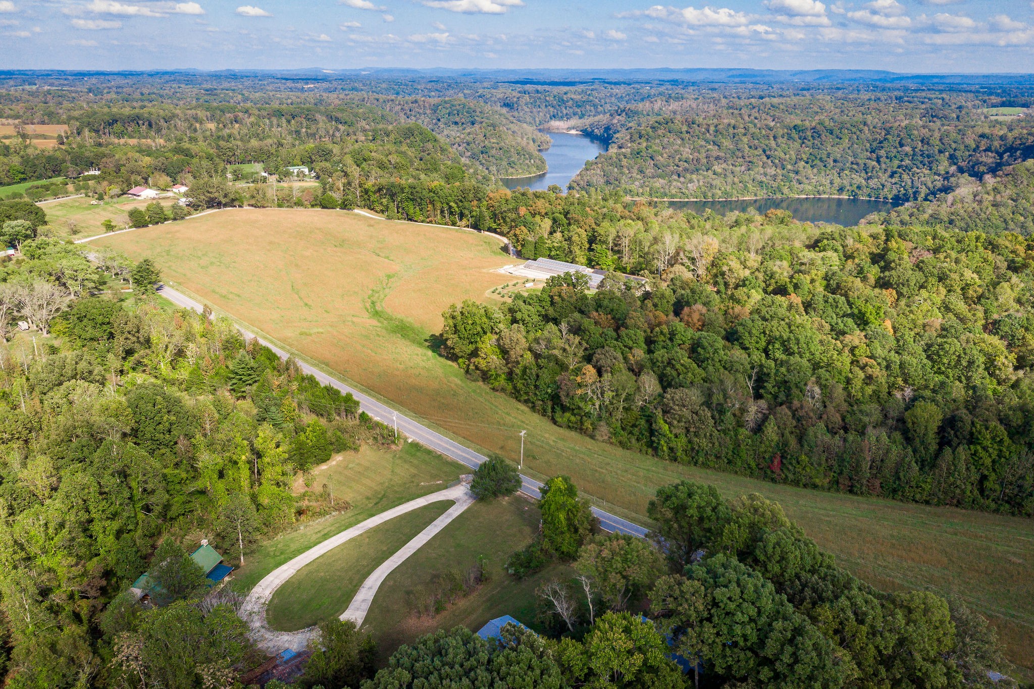 12159 Cookeville Boat Dock Road Baxter, TN 38544 - Photo 3 of 41 a view of a field with an ocean
