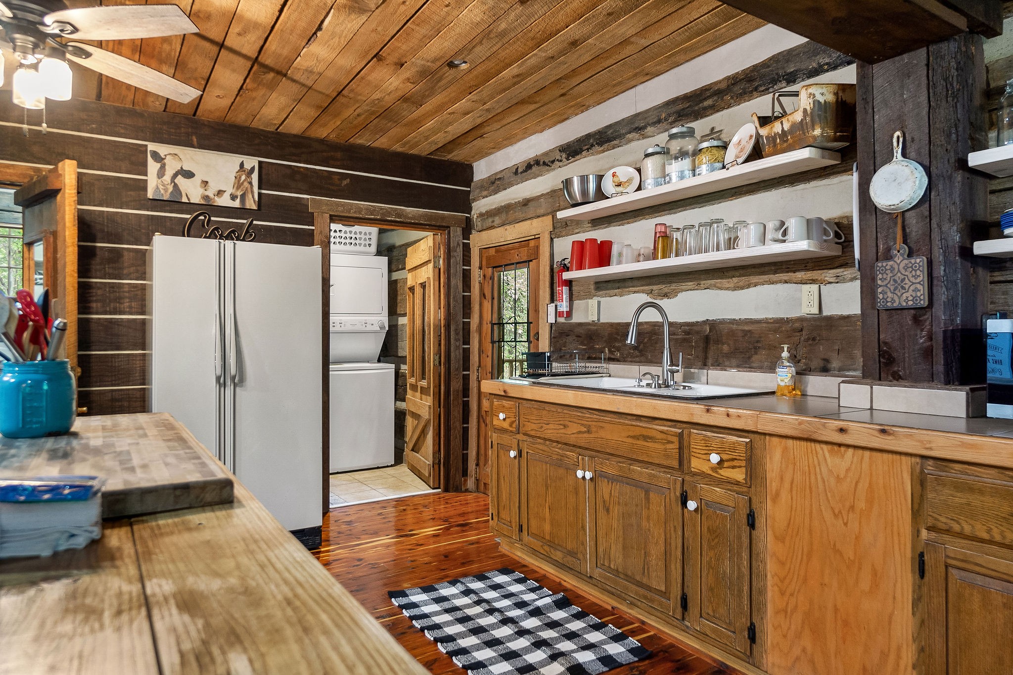 12159 Cookeville Boat Dock Road Baxter, TN 38544 - Photo 34 of 41 a kitchen with stainless steel appliances granite countertop a sink and cabinets