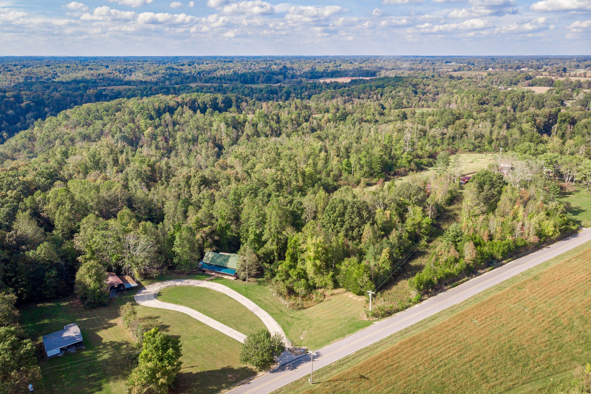 12159 Cookeville Boat Dock Road Baxter, TN 38544 - Photo 39 of 41 a view of a lake with a mountain and a forest