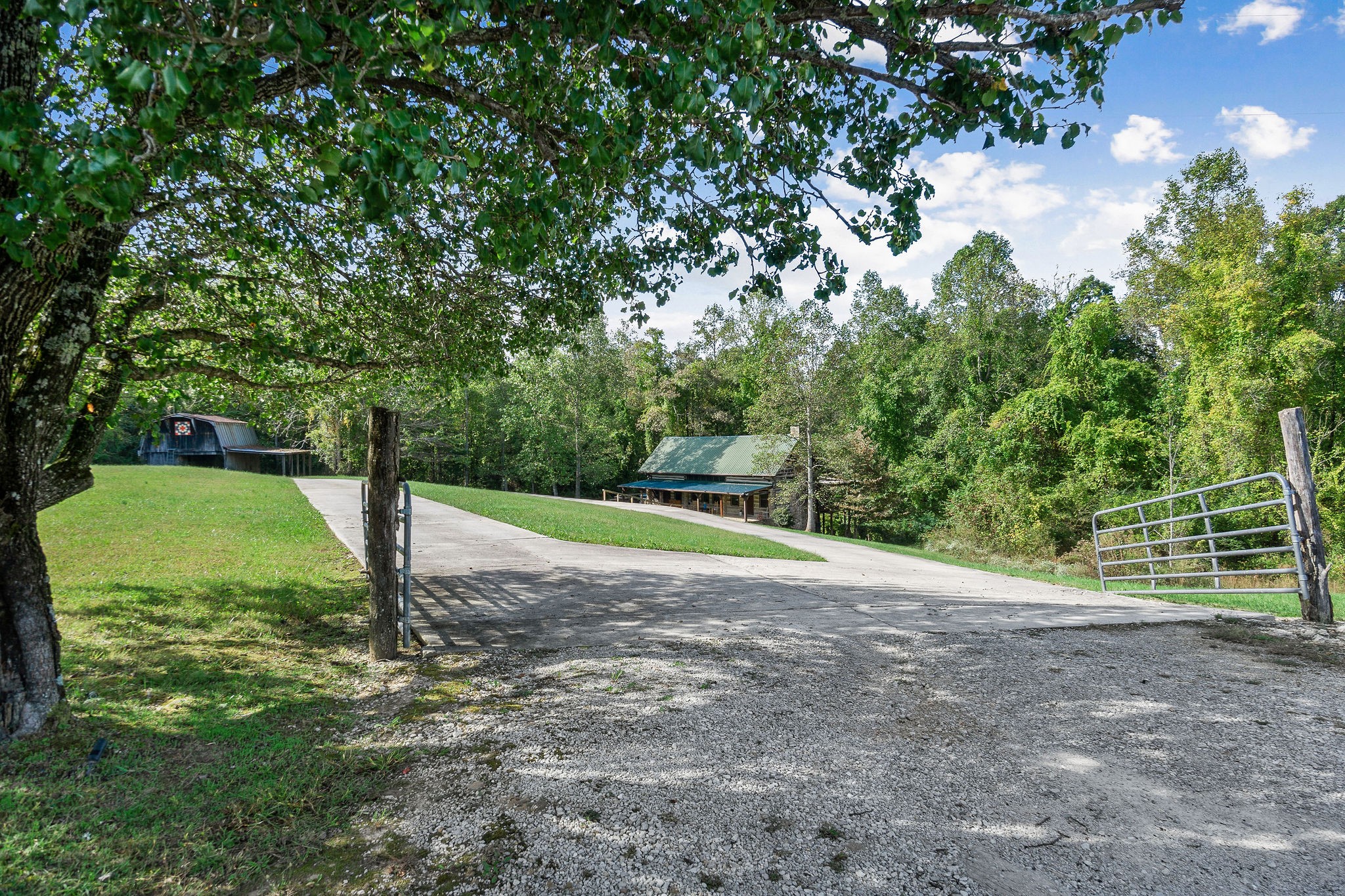 12159 Cookeville Boat Dock Road Baxter, TN 38544 - Photo 4 of 41 a view of a park with large trees