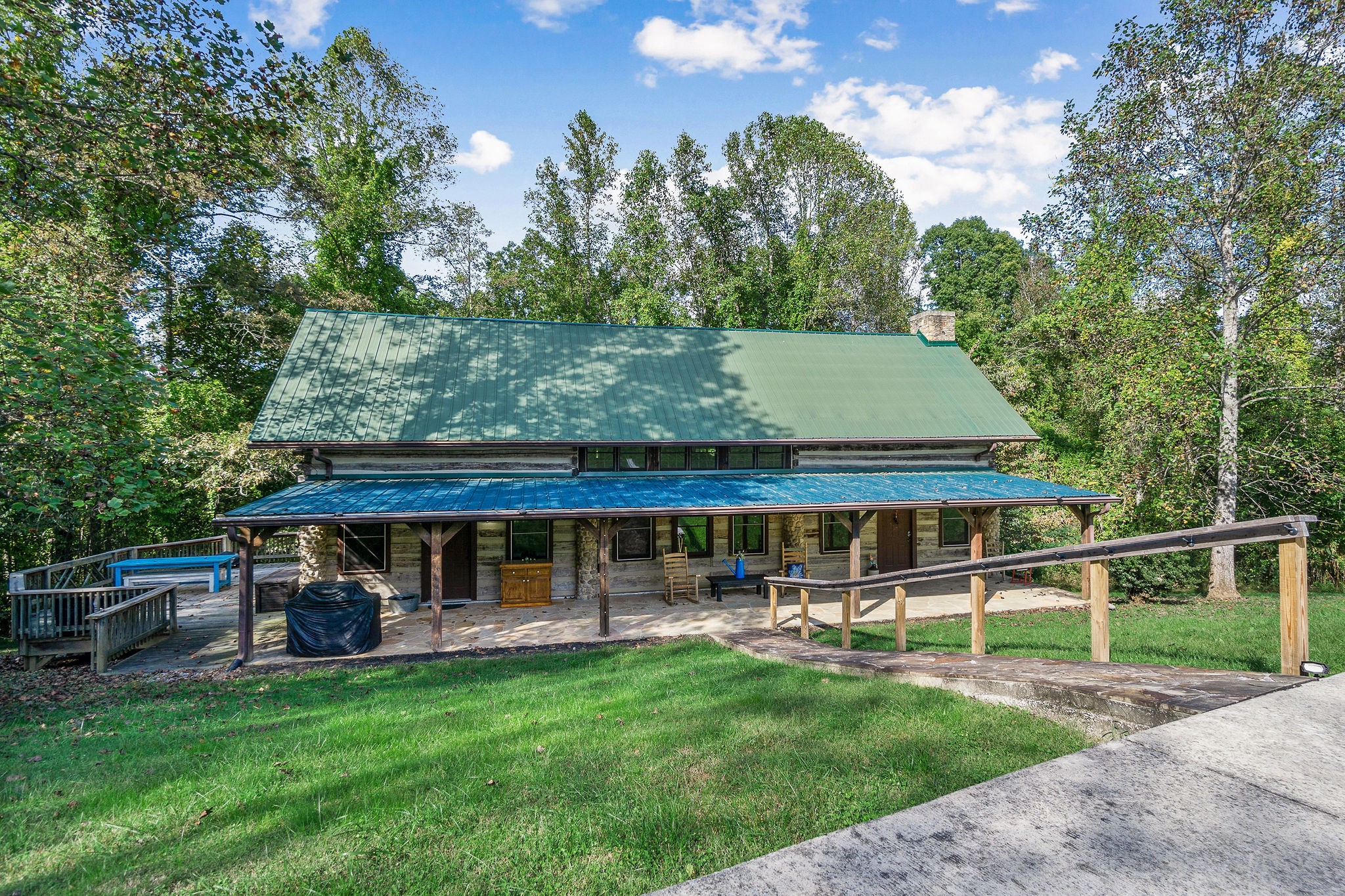 12159 Cookeville Boat Dock Road Baxter, TN 38544 - Photo 8 of 41 a view of a house with backyard porch and sitting area