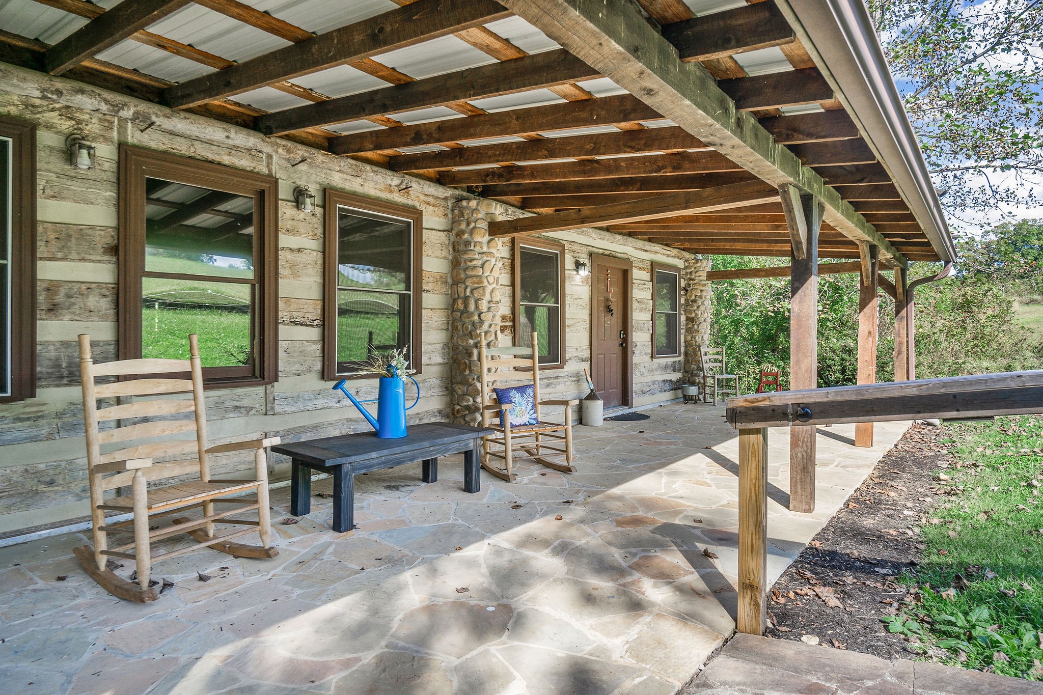 12159 Cookeville Boat Dock Road Baxter, TN 38544 - Photo 9 of 41 a building outdoor space with patio furniture and potted plants