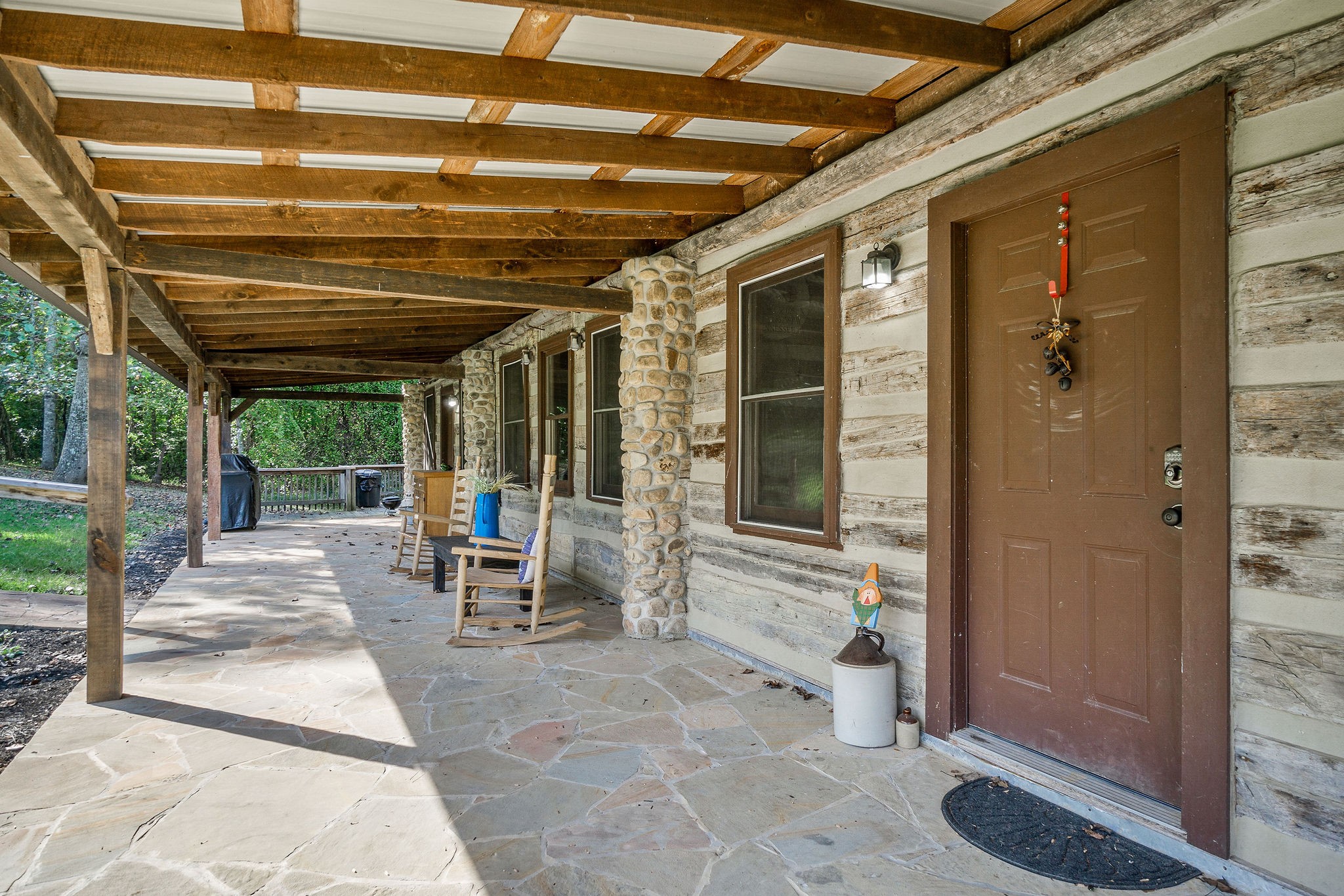 12159 Cookeville Boat Dock Road Baxter, TN 38544 - Photo 10 of 41 a view of a porch with table and chairs