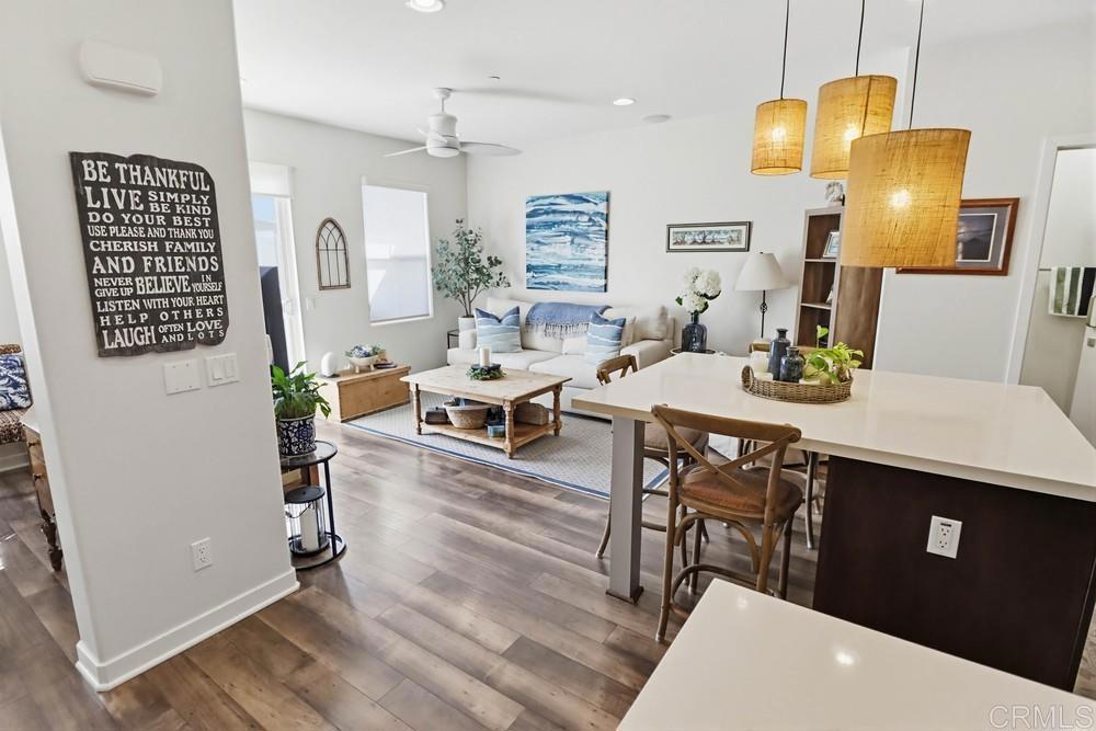 2182 Cosmo Way San Marcos, CA 92078 - Photo 13 of 34 a view of a dining room with furniture and wooden floor