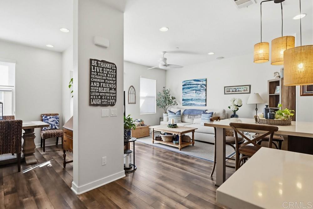 2182 Cosmo Way San Marcos, CA 92078 - Photo 14 of 34 a living room with lots of furniture and a wooden floor