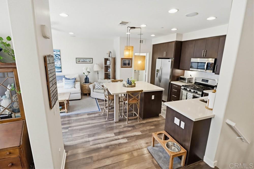 2182 Cosmo Way San Marcos, CA 92078 - Photo 15 of 34 a large kitchen with a table and chairs