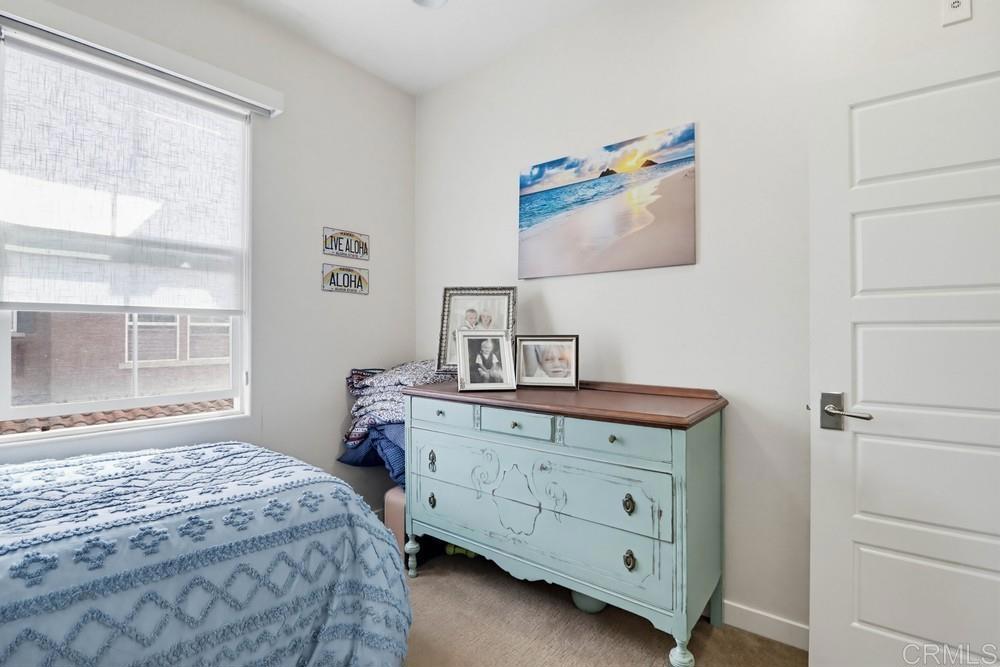 2182 Cosmo Way San Marcos, CA 92078 - Photo 25 of 34 a bedroom with a bed and a window