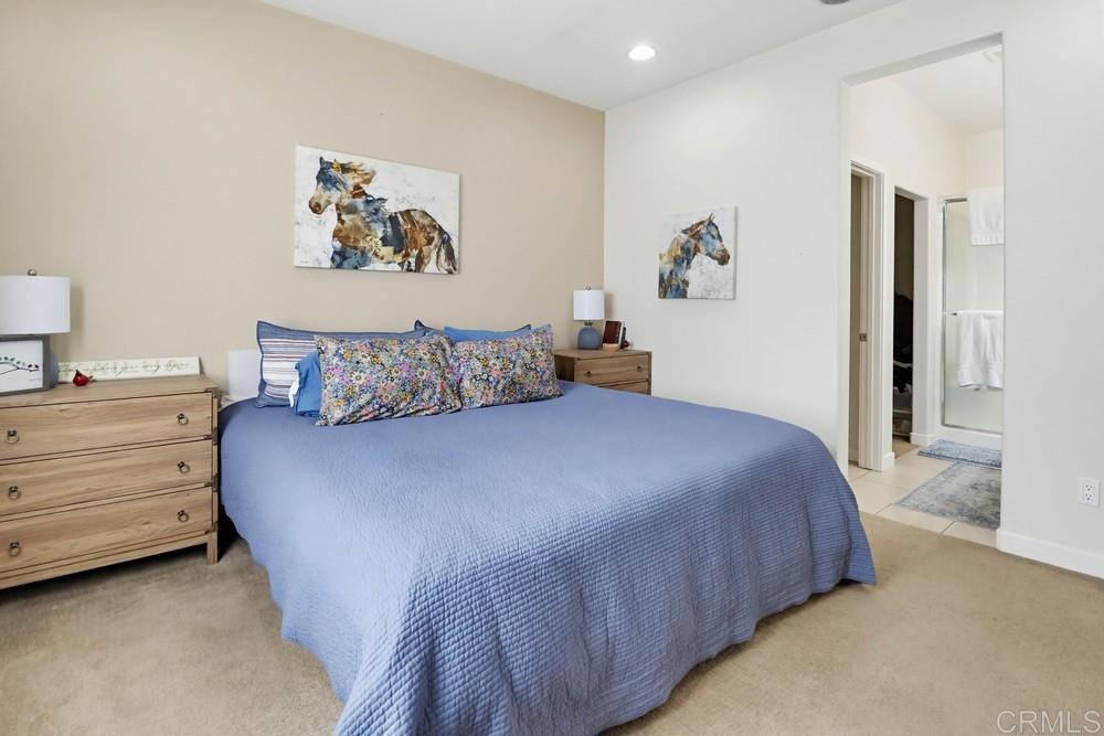 2182 Cosmo Way San Marcos, CA 92078 - Photo 30 of 34 a bedroom with a bed and wall painting