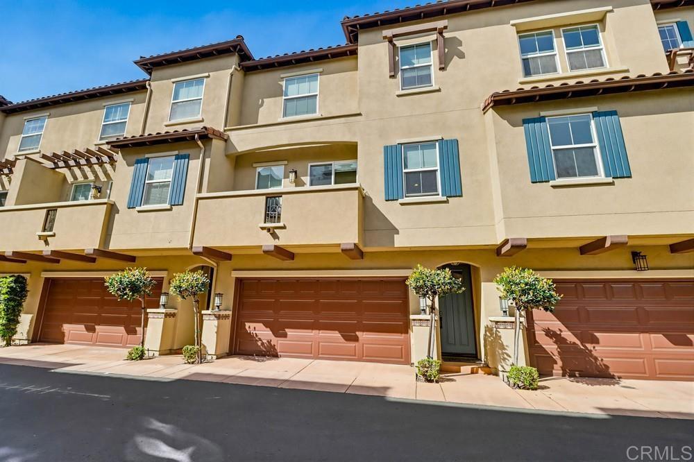 2182 Cosmo Way San Marcos, CA 92078 - Photo 3 of 34 a front view of a house with parking