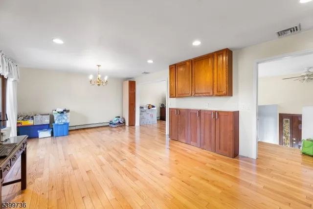 a view of a livingroom with furniture and an empty room
