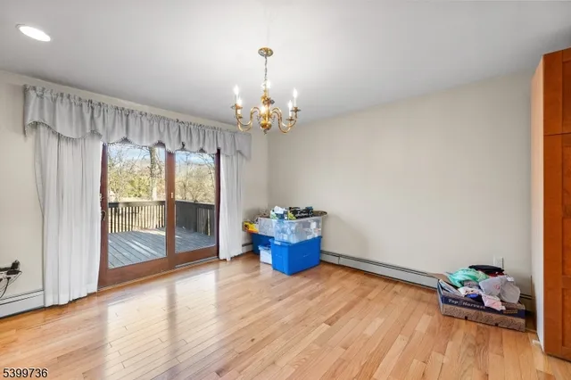 a dining room with furniture mountain view and wooden floor