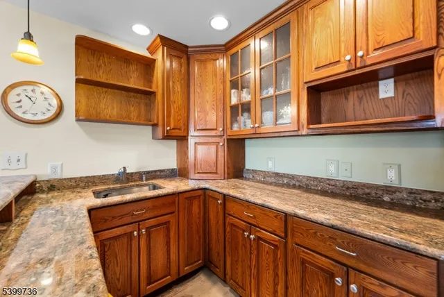 a kitchen with stainless steel appliances granite countertop cabinets and a dishwasher