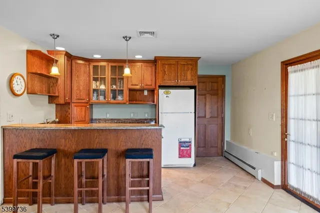 a kitchen with a table and chairs in it