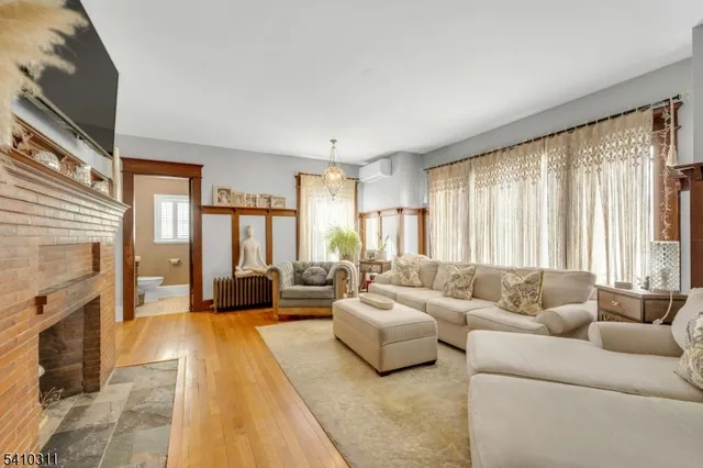 a living room with furniture and large windows
