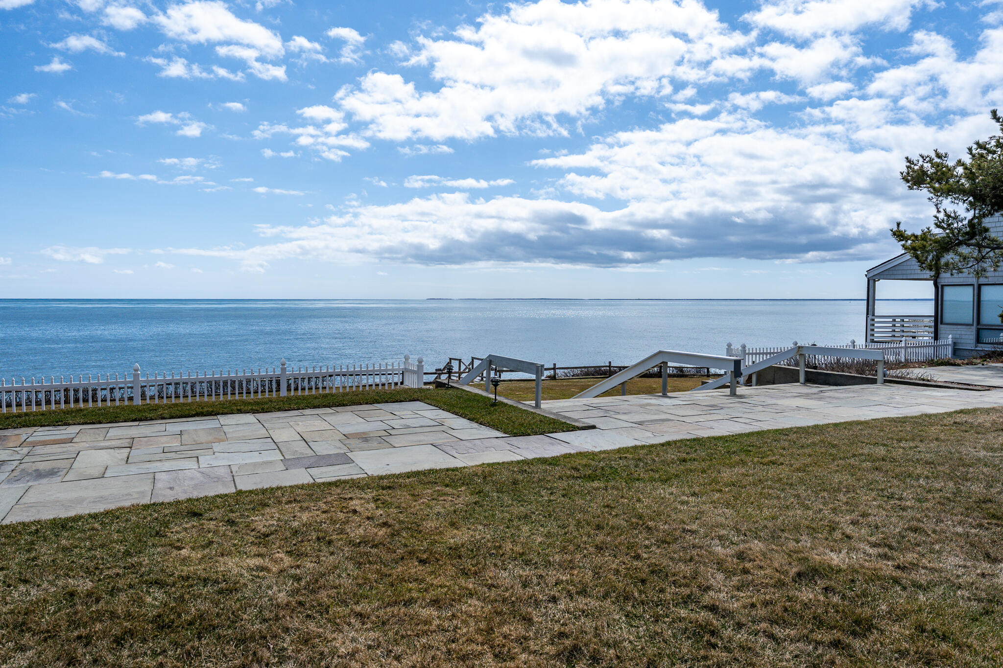 a view of a swimming pool with an ocean view